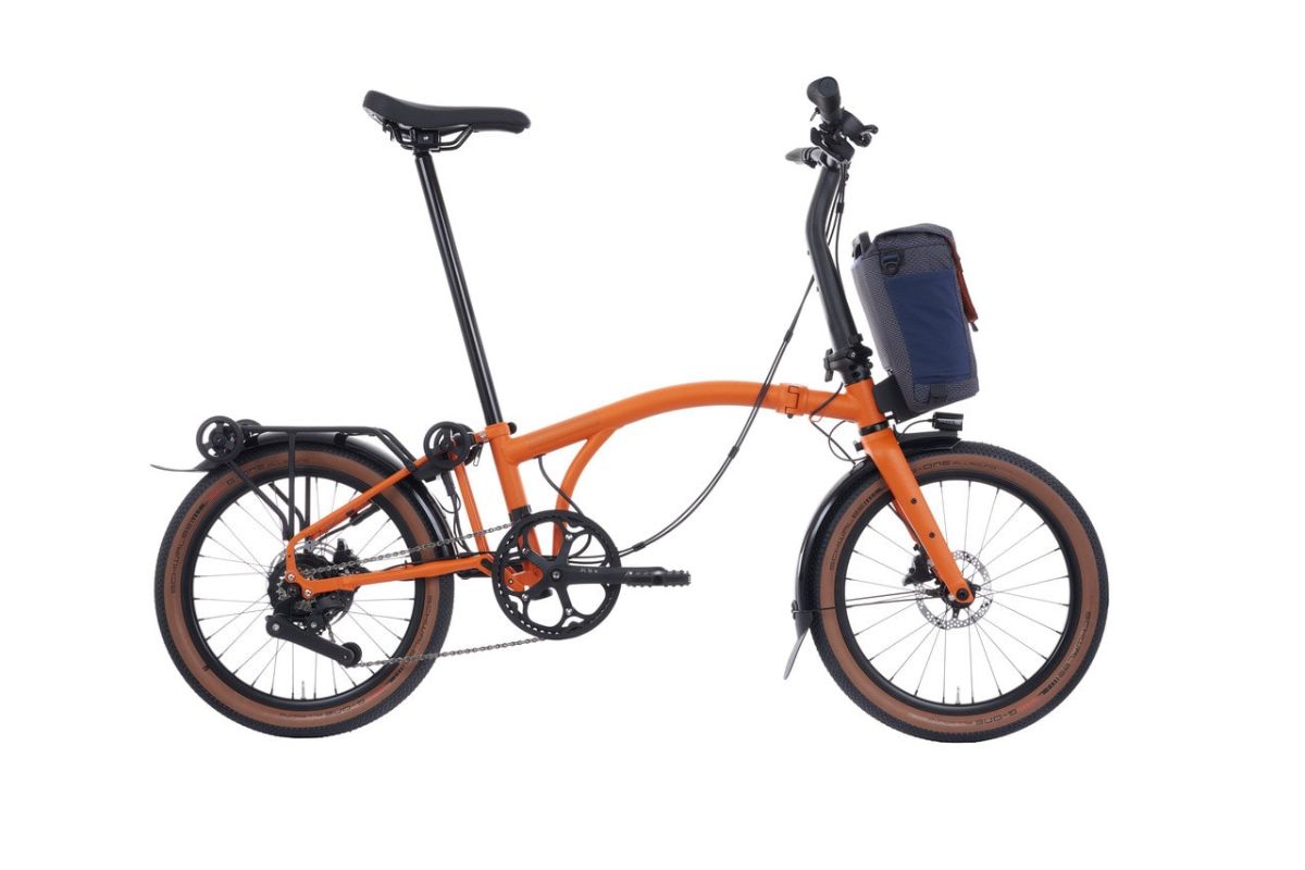 Orange Brompton Electric G Line with battery bag over front wheel and rear rack