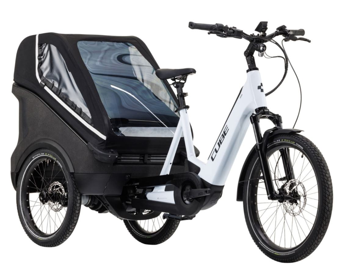 White electric tricycle with twin rear wheels and a rear load space for two kids or luggage