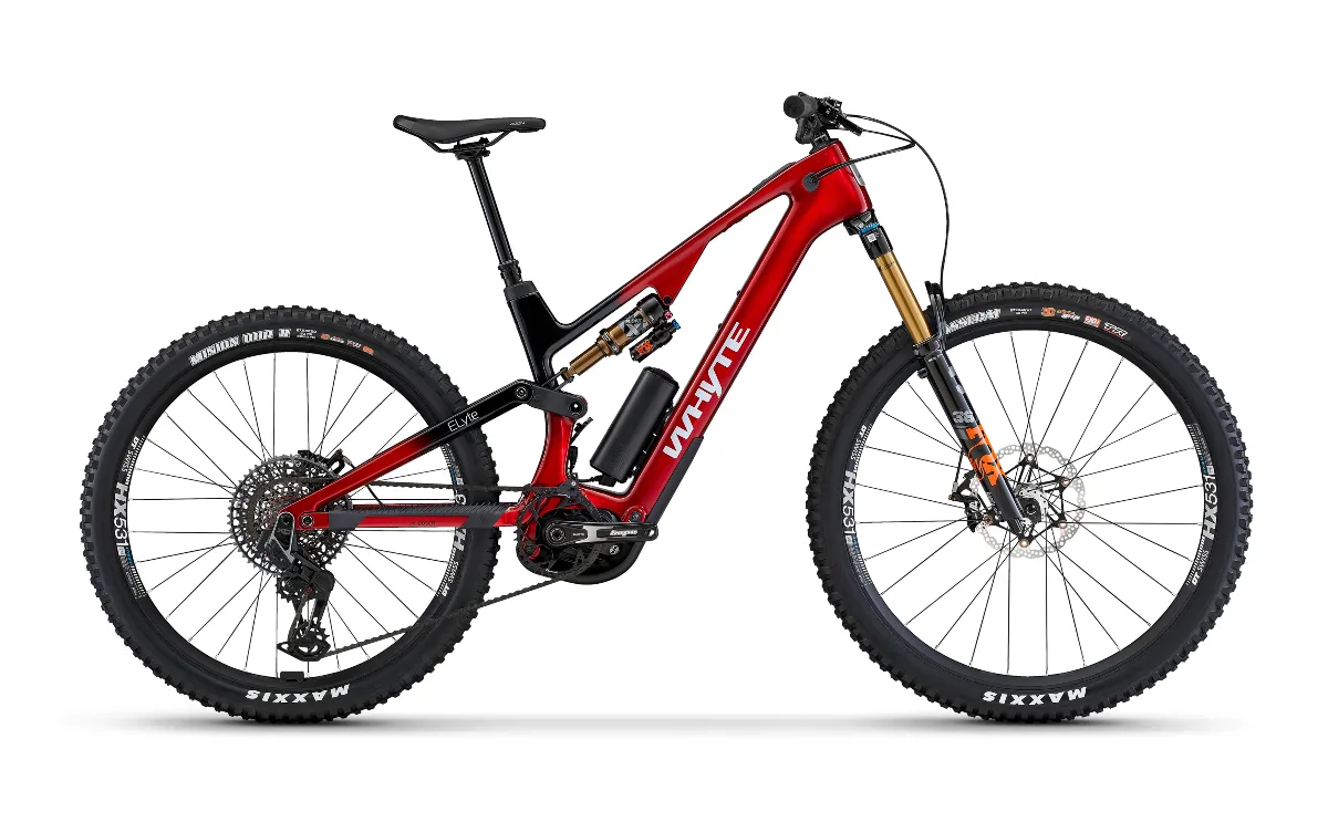 Red full suspension Whyte electric mountain bike in a studio