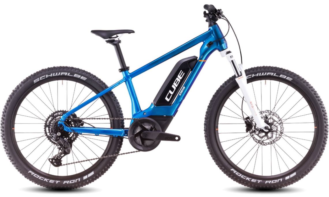 Studio photograph of bright blue kid's e-mountain bike with removable battery