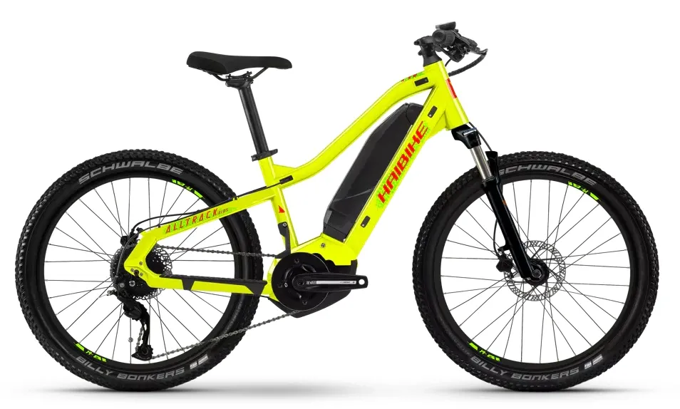 Studio photograph of a bright yellow kid's e-mountain bike with removable battery