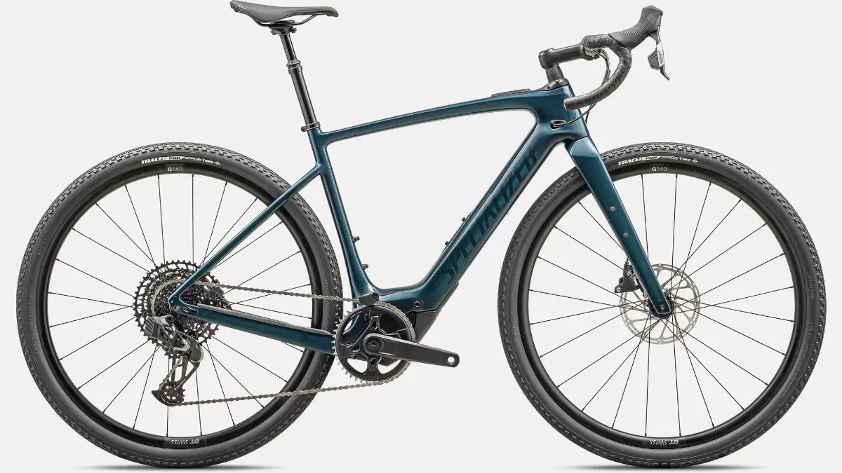 Studio photo of a teal electric gravel bike with integrated mid-drive motor